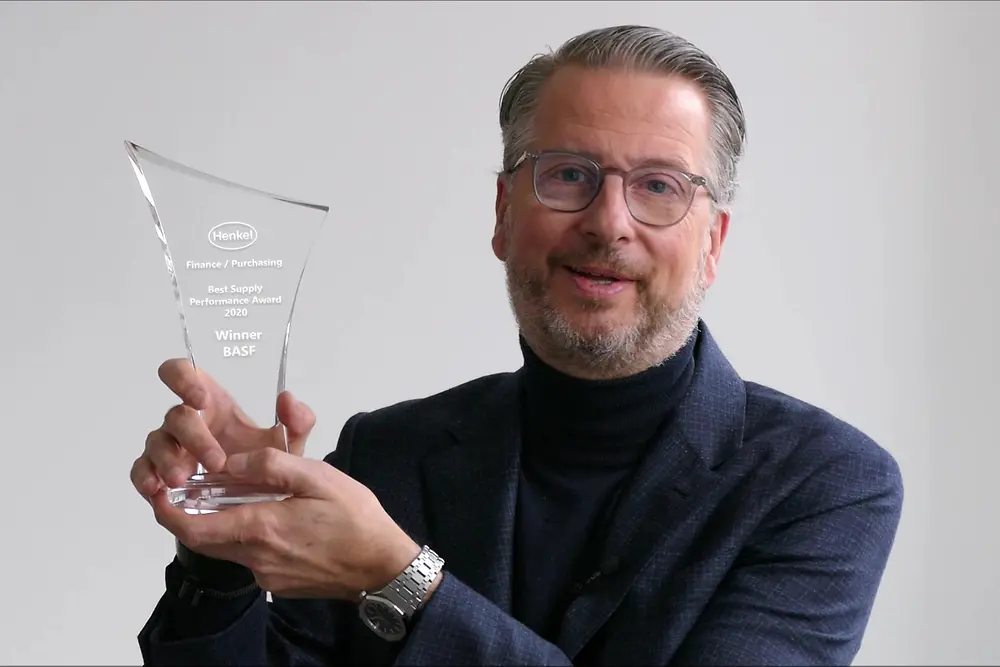 Raloh Schweens holding an award